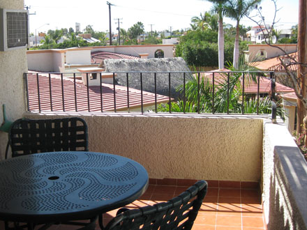 Large, covered decks come with table and chairs,
planter to hold your own plants,
and hose for easy clean-up,